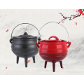 round cast iron enamel potjie pot with three-leggs for dish prepared outdoors